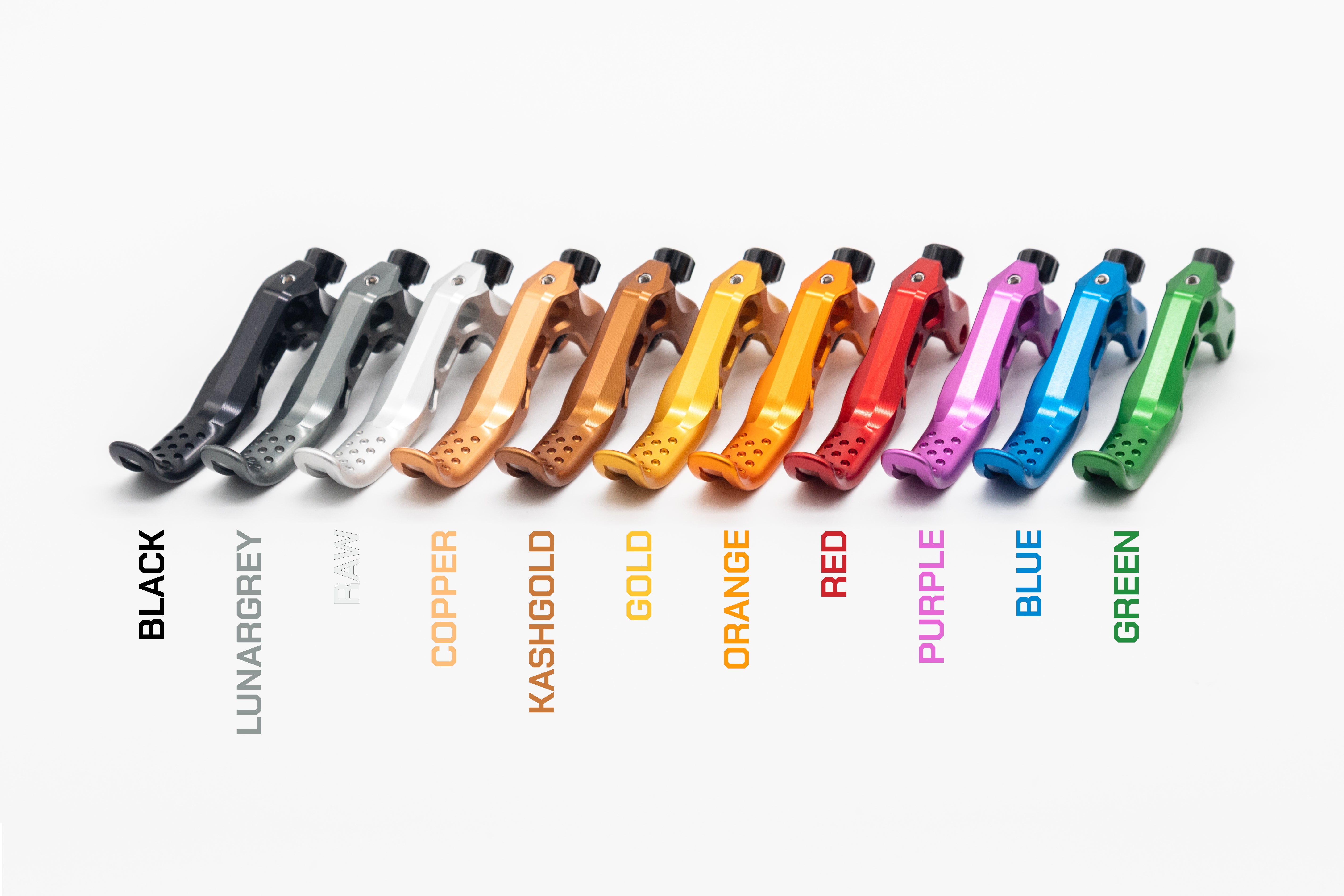 Twelve mountain bike levers in black, lunar grey, raw, copper, and gold, with perforated grips and knobs.