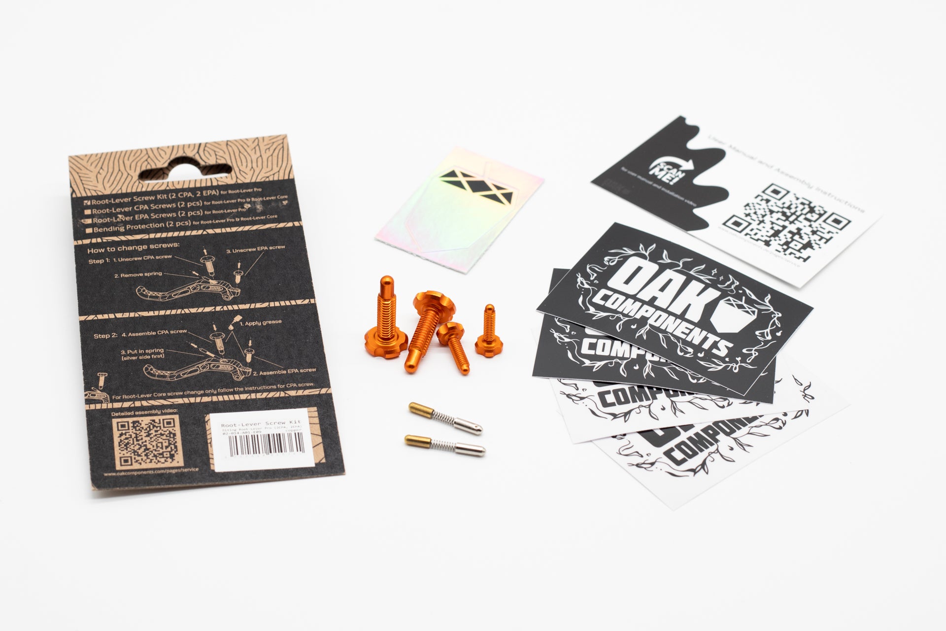 Root-Lever Screw Kit with four orange screws, two springs, instruction packaging, and promo cards with QR codes.
